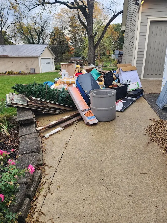 Dumpster being loaded with debris for Roofing Dumpster Rental in North Port